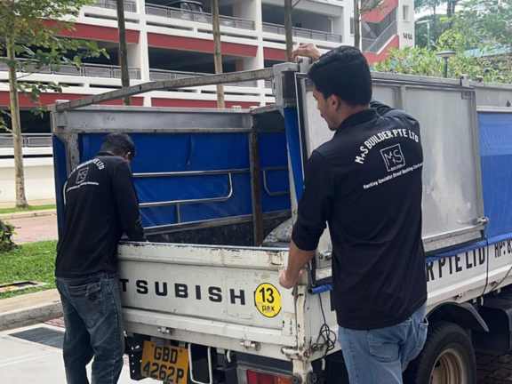 Disposal services truck loading waste Singapore